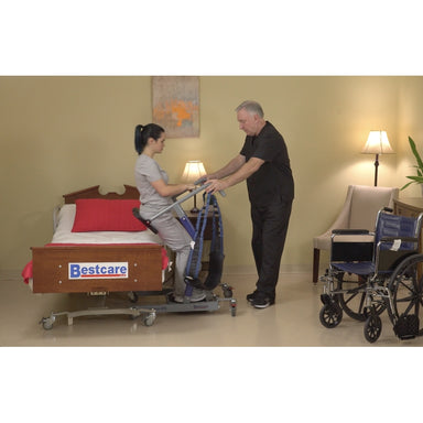 Bestcare STA450 BestMove standing transfer aid front view with person lowering onto the bed in new condition