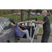 Bestcare PL350CT foldable portable electric mobile lift with person in sling transferring out from car in new condition