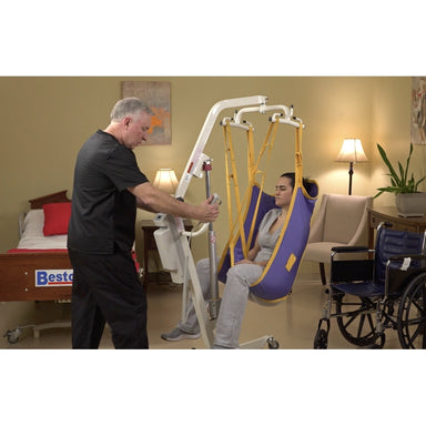 Bestcare PL400HE electric mobile lift with person in sling in new condition