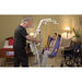 Bestcare PL400HE electric mobile lift with person in sling in new condition